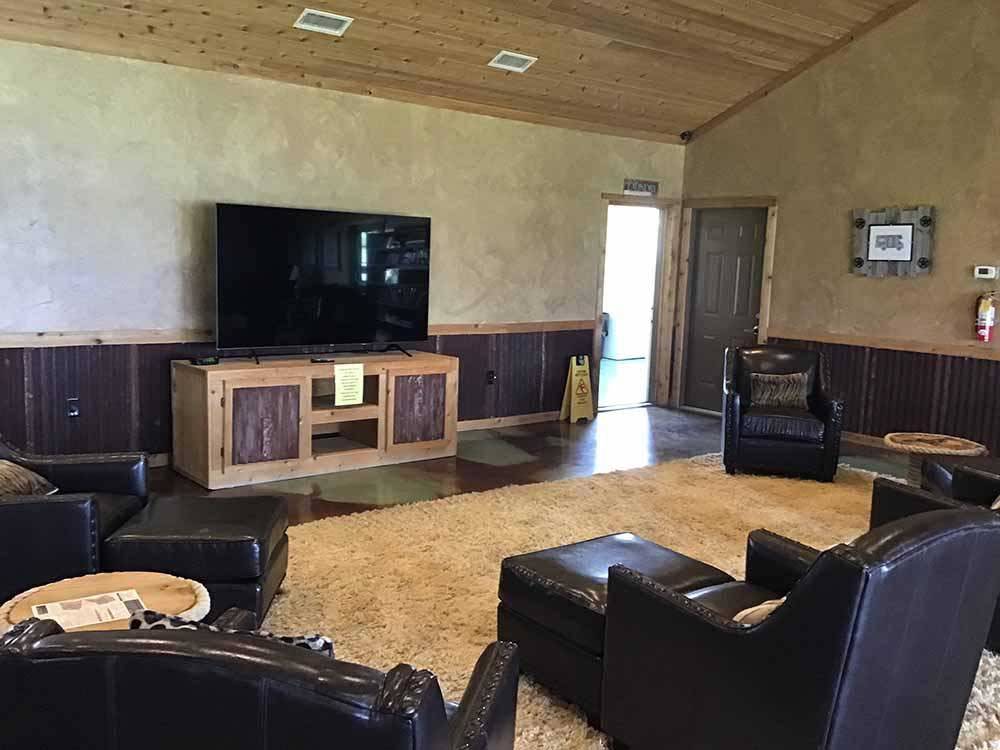 Chairs and TV in the social area at TEXAS LAKESIDE RV RESORT