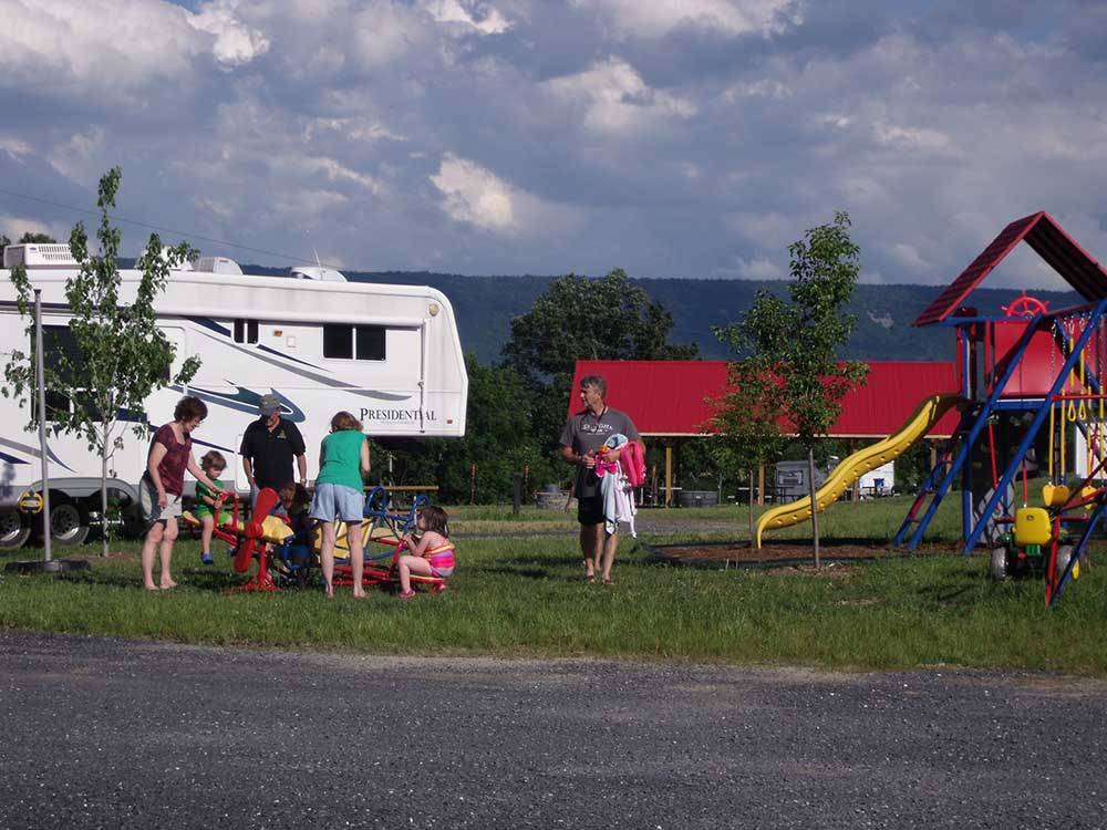 People playing on the playground at SHENANDOAH VALLEY CAMPGROUNDS