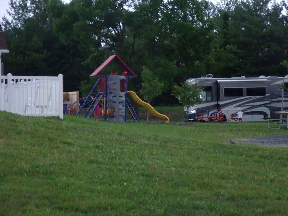 A motorhome by the playground at SHENANDOAH VALLEY CAMPGROUNDS