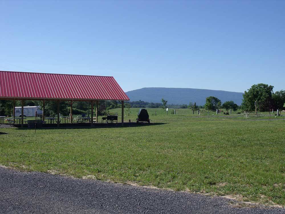 Picnic tables under the pavilion at SHENANDOAH VALLEY CAMPGROUNDS