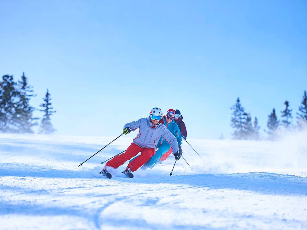 Skiers going down hill