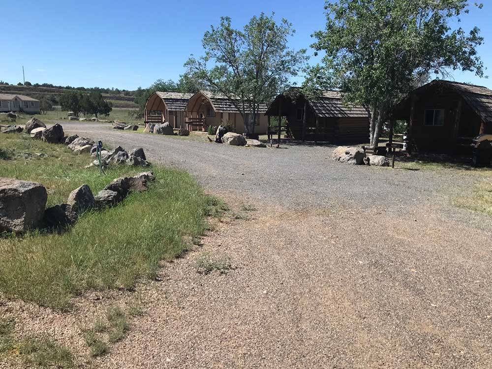 A row of wooden rental cabins at GRAND CANYON VIEW RV
