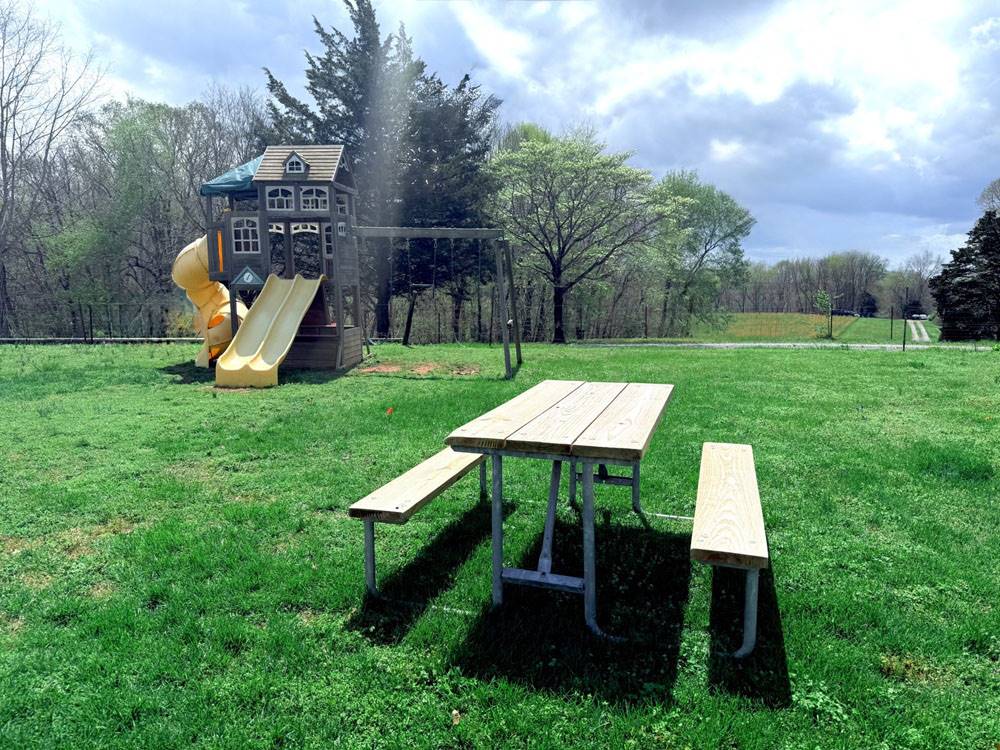 A picnic table and play structure