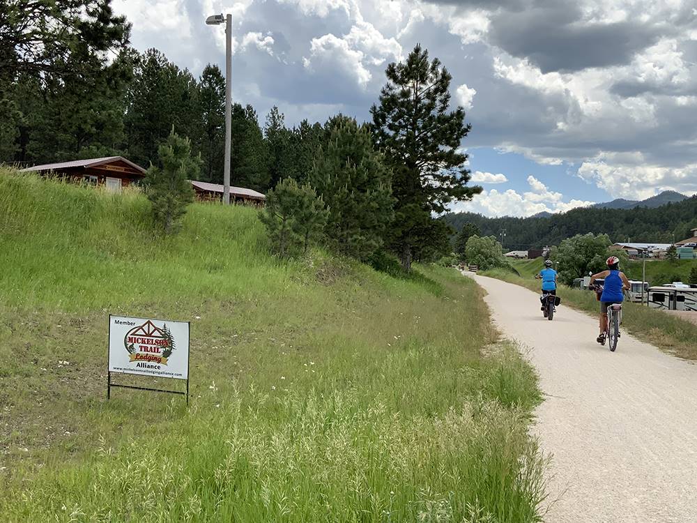 People walking the Mickelson Trail at Black Hills Trailside Park Resort