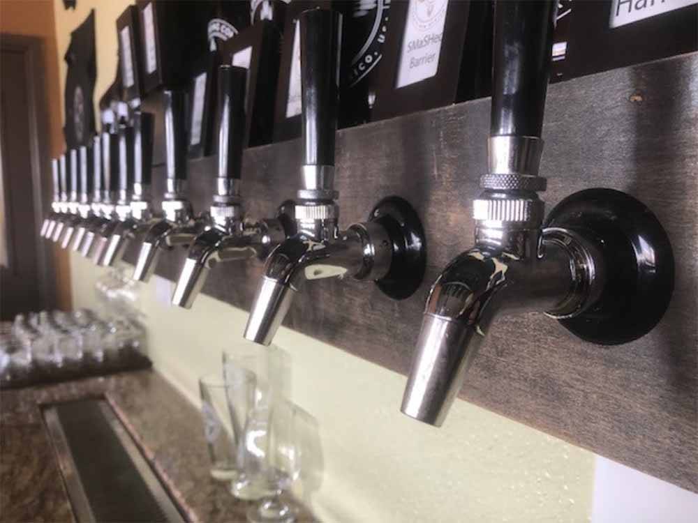 A line of beer taps at the brewery next door at LAVALAND RV PARK