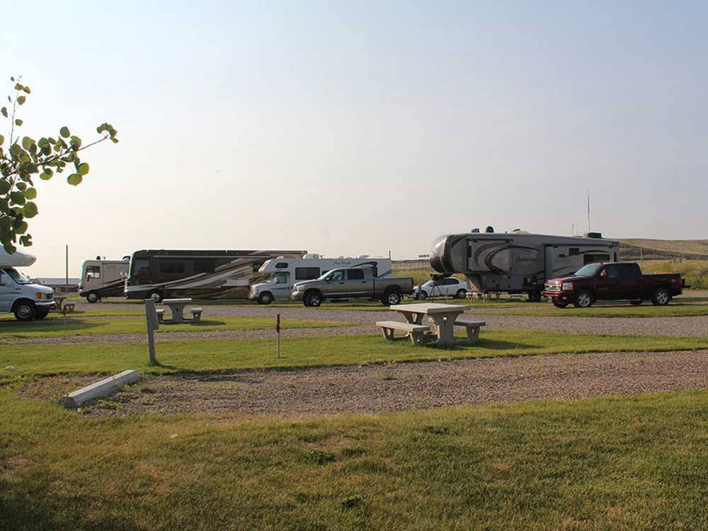 An empty gravel campsite with a picnic table at TRAILS WEST RV PARK