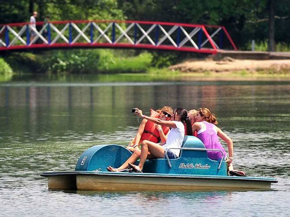 Girls paddle boating on lake at CERALAND PARK & CAMPGROUND
