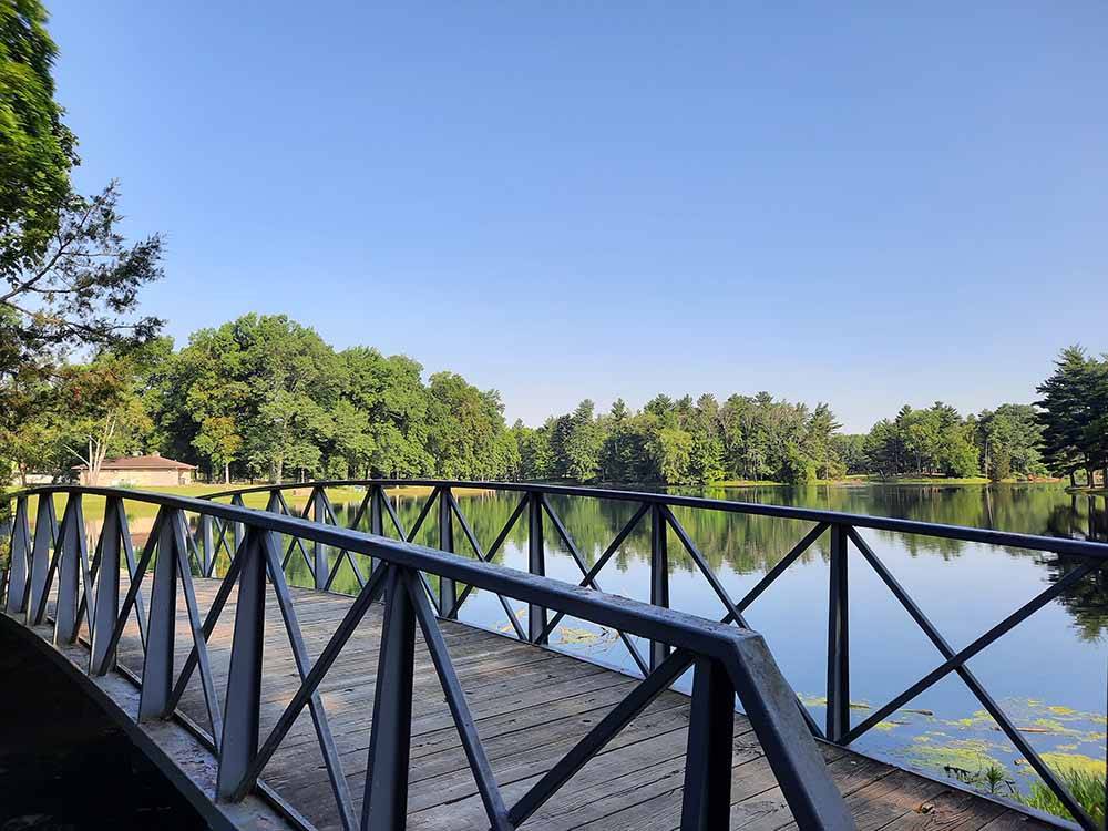 A walking bridge over the water at CERALAND PARK & CAMPGROUND