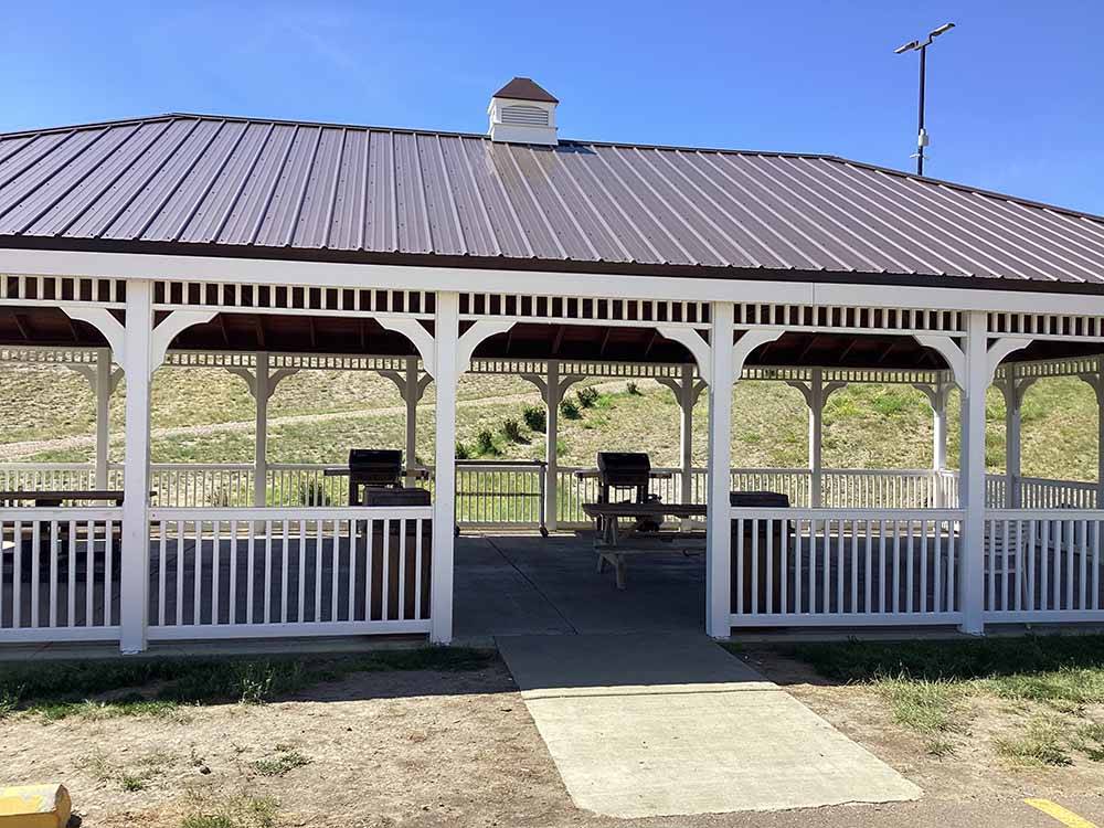 A white wooden pavilion at SHELBY RV PARK AND RESORT