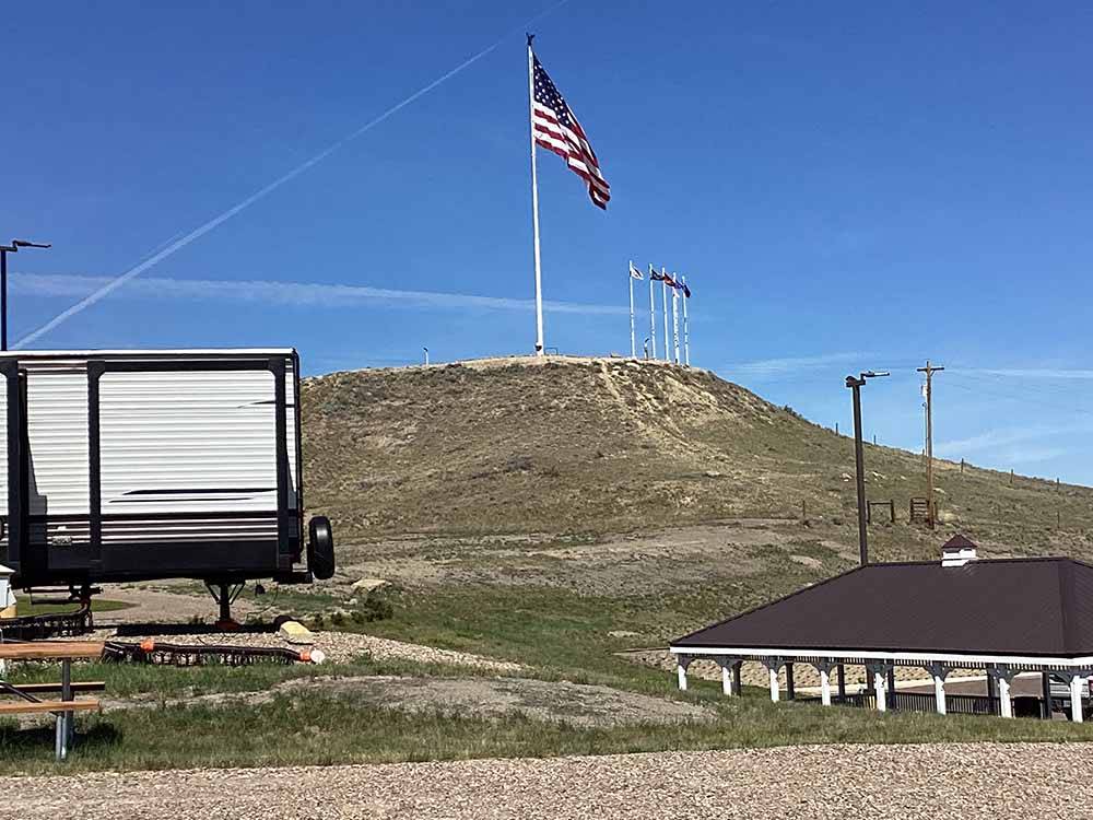 An American flag on a hill over the campsites at SHELBY RV PARK AND RESORT