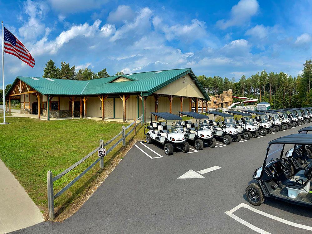 Aerial view of a lot of golf carts parked by the office at MOOSE HILLOCK CAMPING RESORT NY