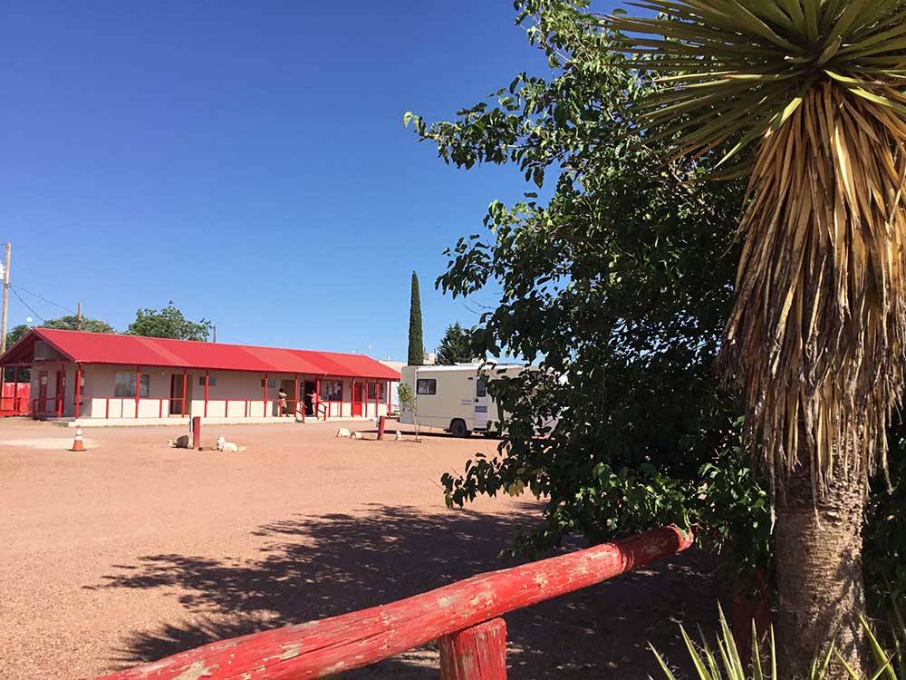 View of main building on sunny day at WILD WEST RV PARK