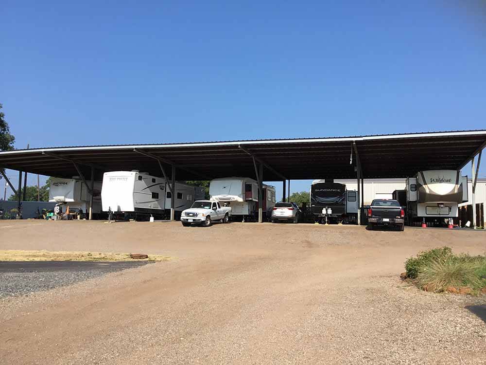 A row of covered RV parking at NORTH POINT RV PARK