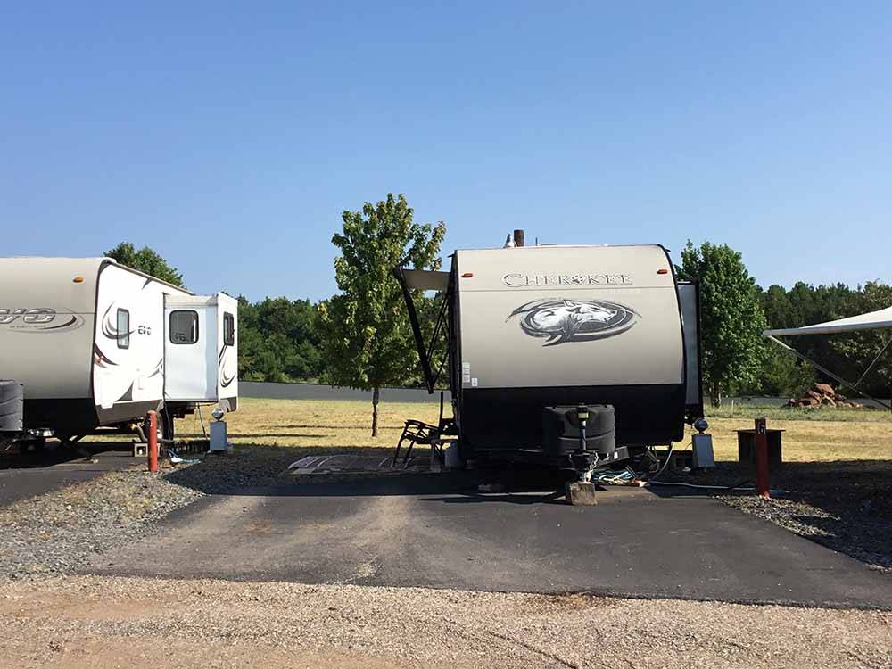 A fifth wheel trailer in a back in site at NORTH POINT RV PARK