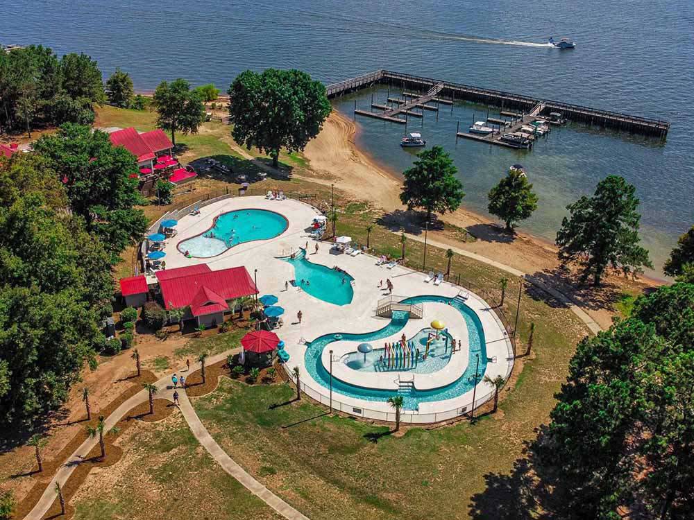 An aerial view of the lazy river, swimming pool, and docks at PALMETTO SHORES RV RESORT