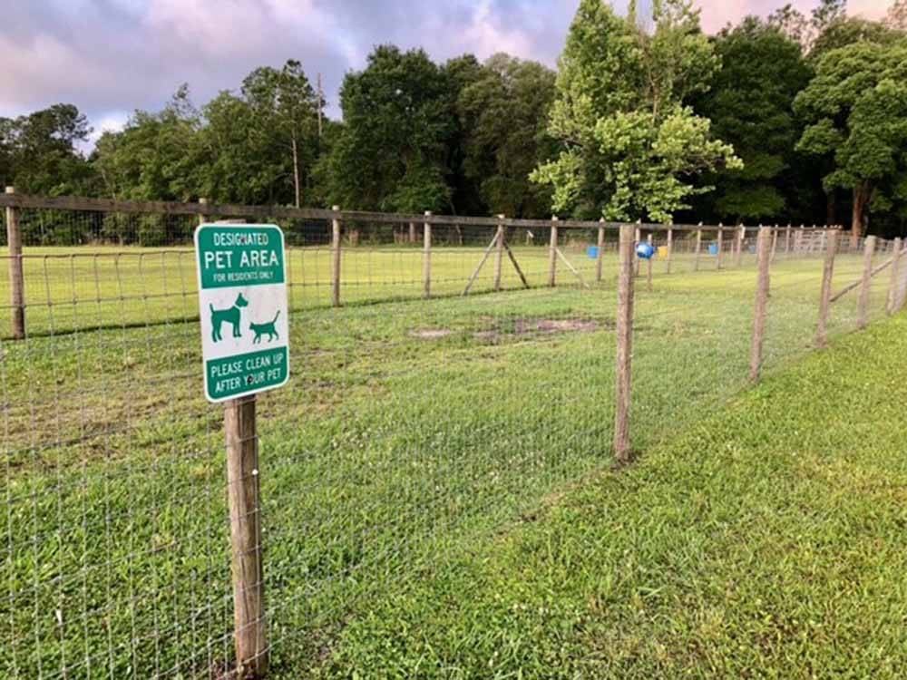 The fenced in pet area at GAINESVILLE RV PARK
