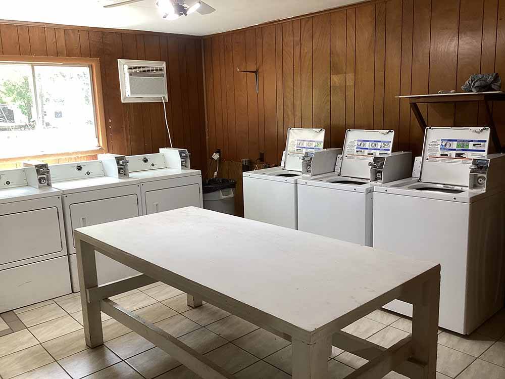 The washers and dryers with a folding table at LAKE EUFAULA CAMPGROUND