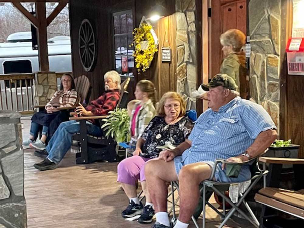 A group of people sitting at the front office at GREYSTONE RV PARK