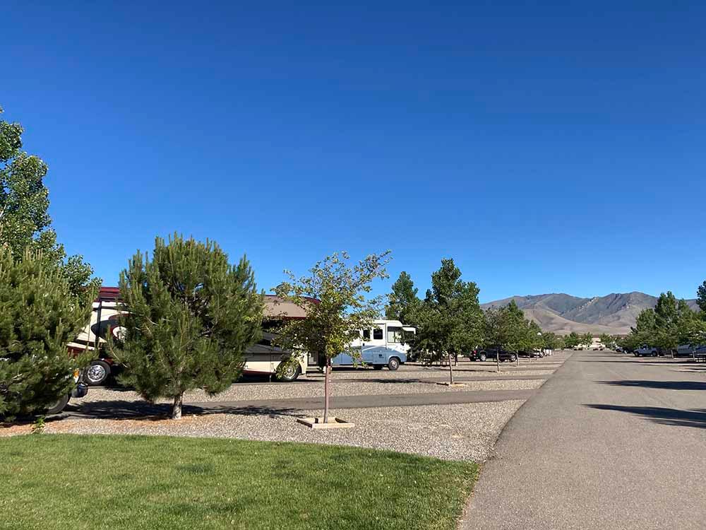 A row of paved RV sites at NEW FRONTIER RV PARK