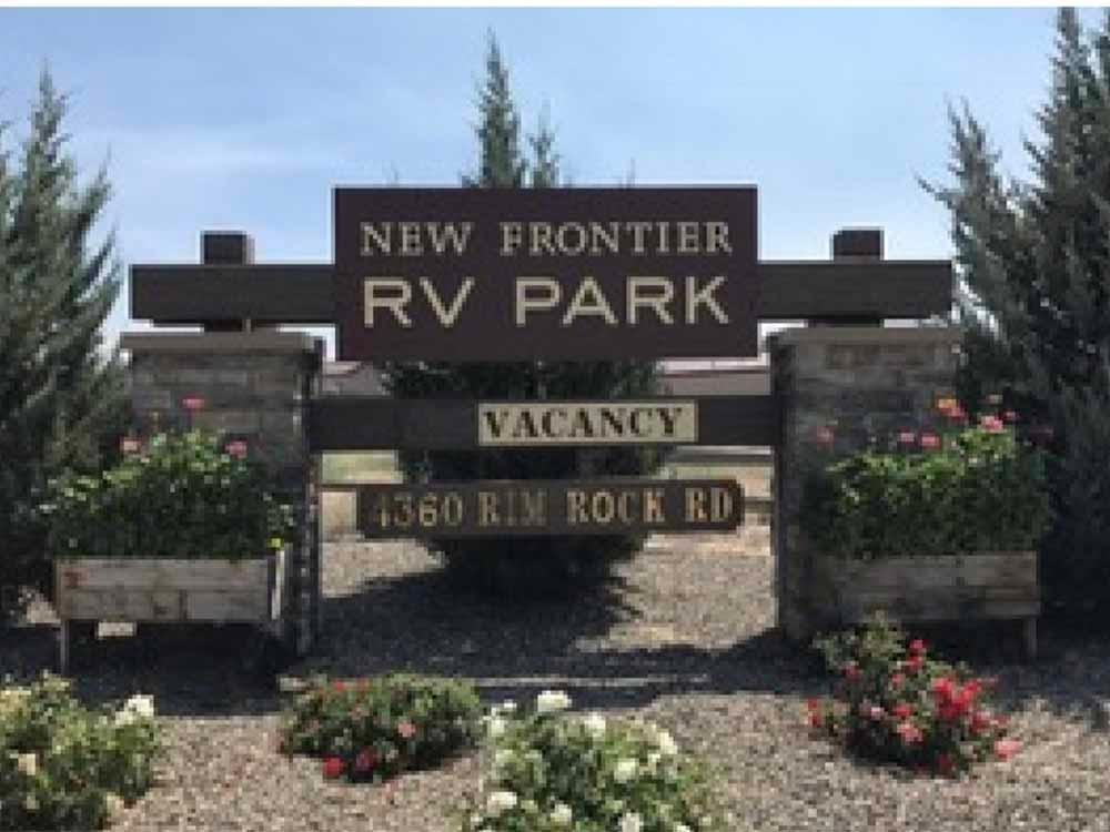 The front entrance sign at NEW FRONTIER RV PARK