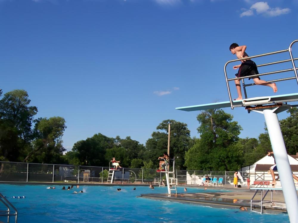 Swimming pool with diving board