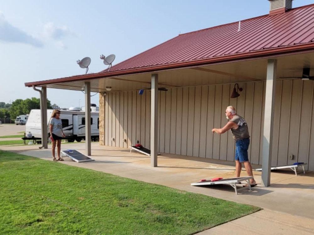 People playing cornhole at THE CAMPGROUND COLLECTIVE