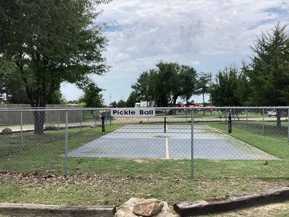 The fenced in pickle ball court at LITTLE TURTLE RV & STORAGE