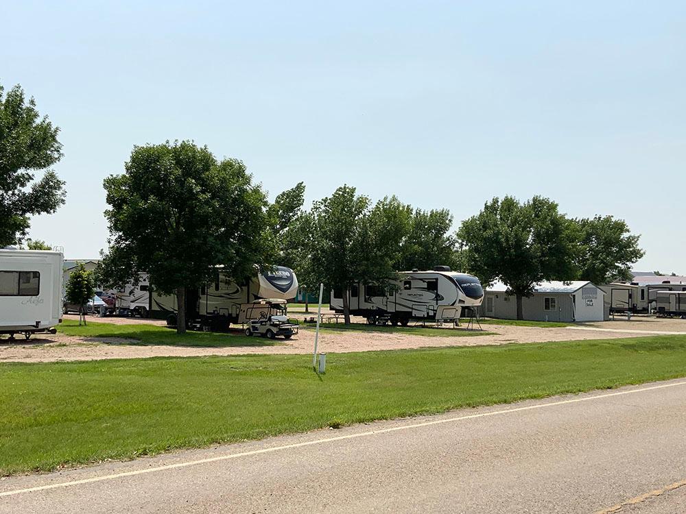 View of the RV sites from a paved road at D & S CAMPGROUND & LODGE