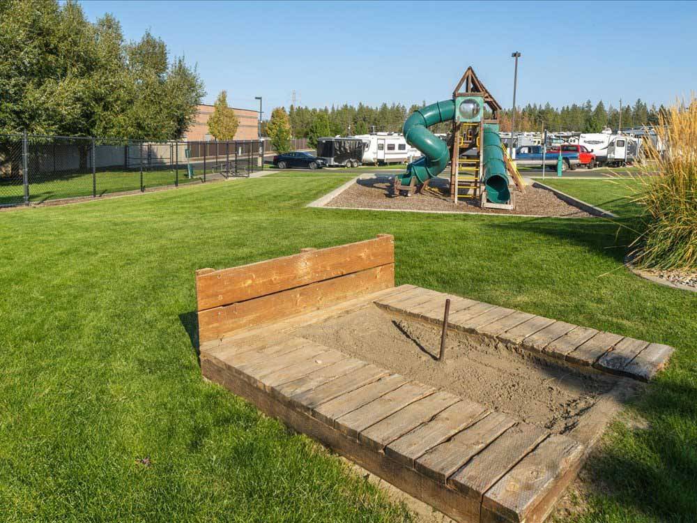 Horeshoes pit and a children's playground at NORTH SPOKANE RV CAMPGROUND