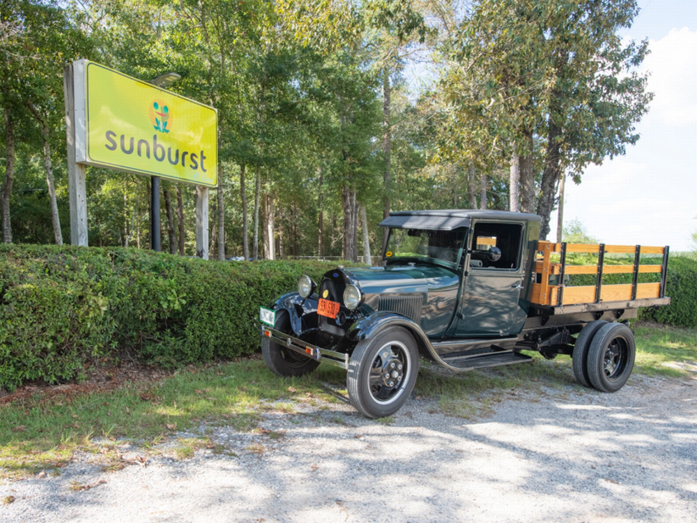 Sign and vintage truck at Sunburst RV Resort