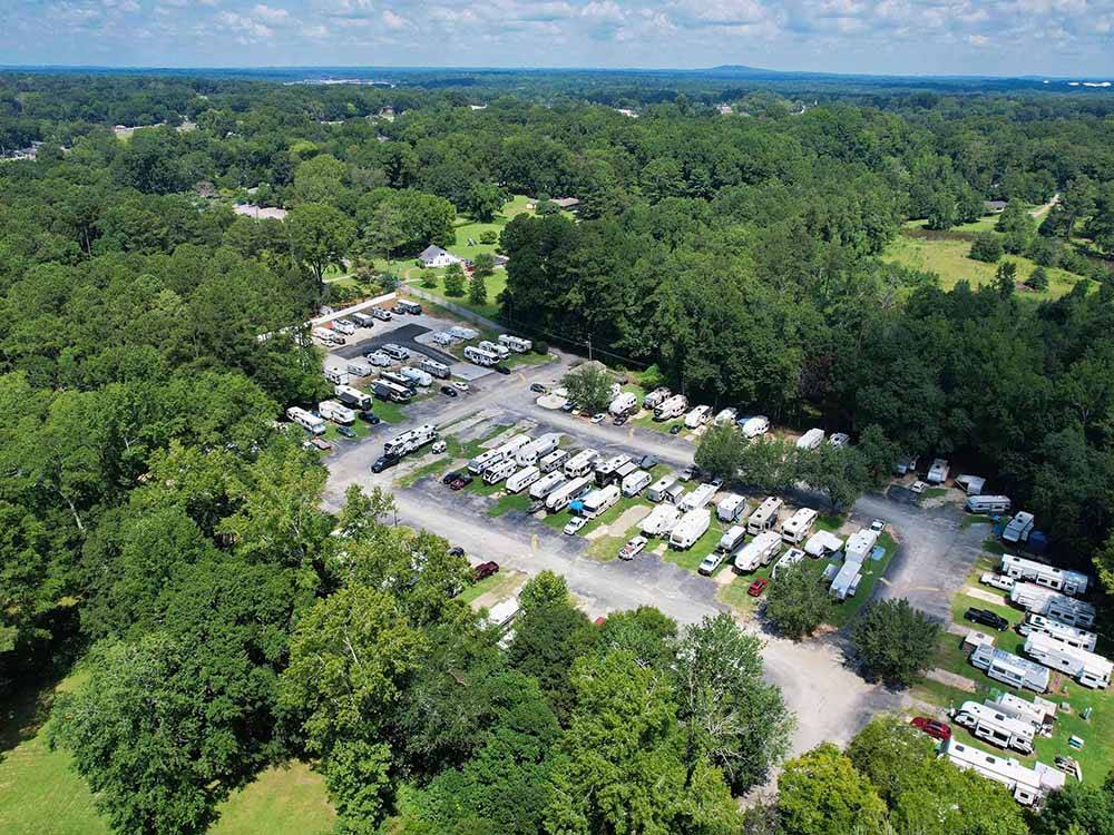 Aerial shot of RV park surrounded by forested landscape at SWEETWATER CREEK RV RESERVE