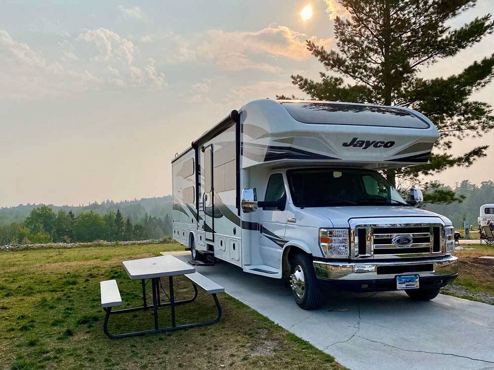 Class C Motorhome parked at campsite at PINES OF KABETOGAMA RESORT