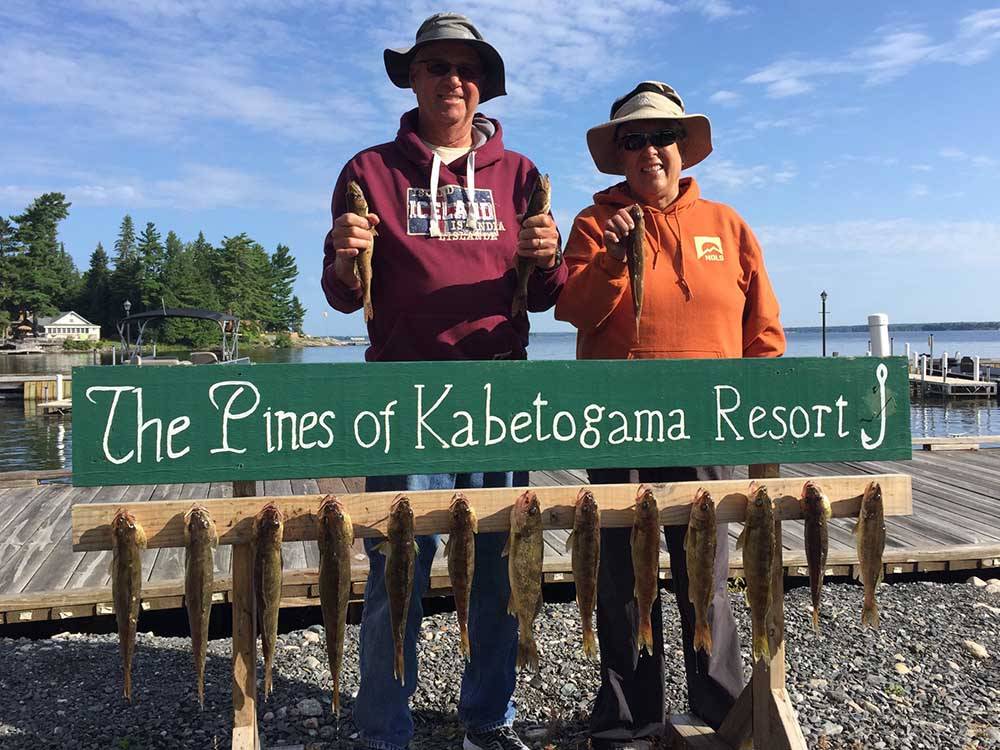 Anglers showing off today's catches at PINES OF KABETOGAMA RESORT