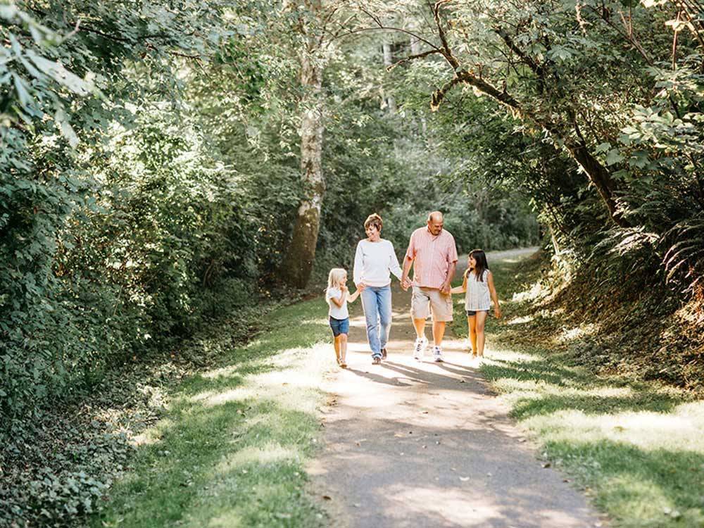 Family walking down trail at FRIENDS LANDING RV PARK