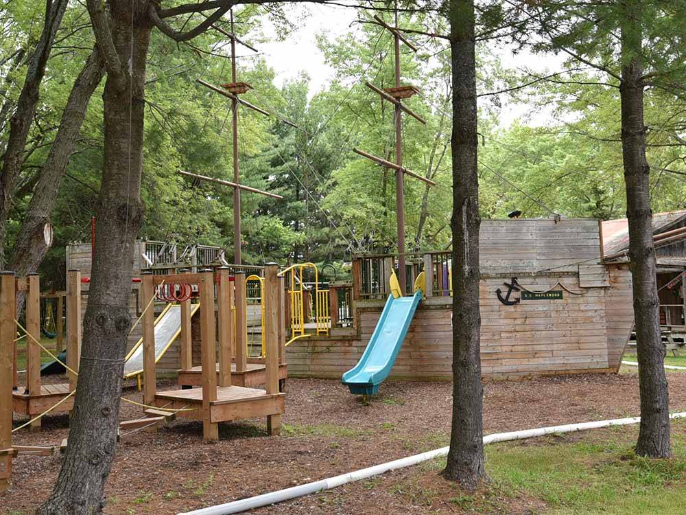 The wooden playground equipment at MAPLEWOOD ACRES RV PARK