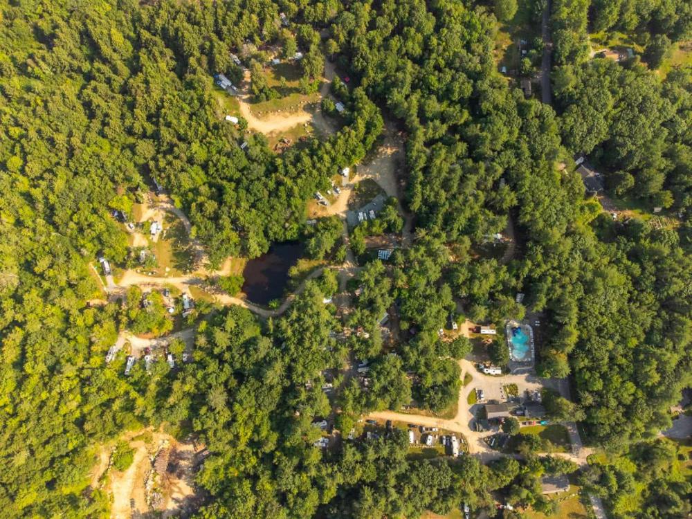 Aerial shot of woods and sites at Spacious Skies Seven Maples