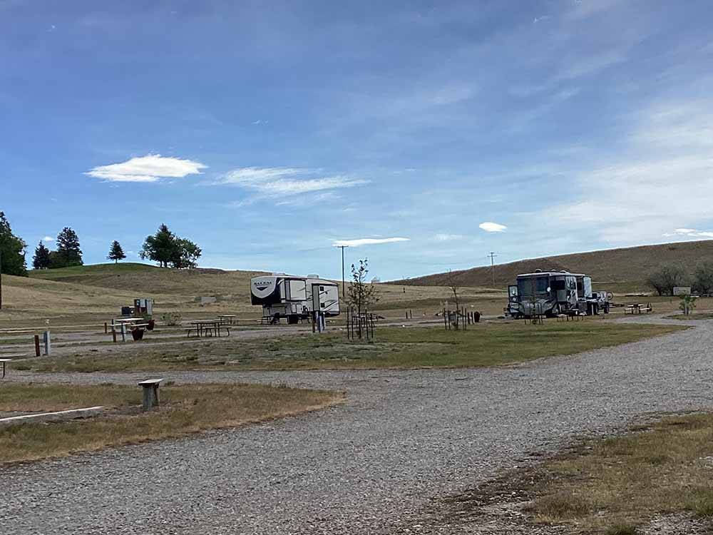 A gravel road and RV sites at CHOTEAU MOUNTAIN VIEW RV CAMPGROUND