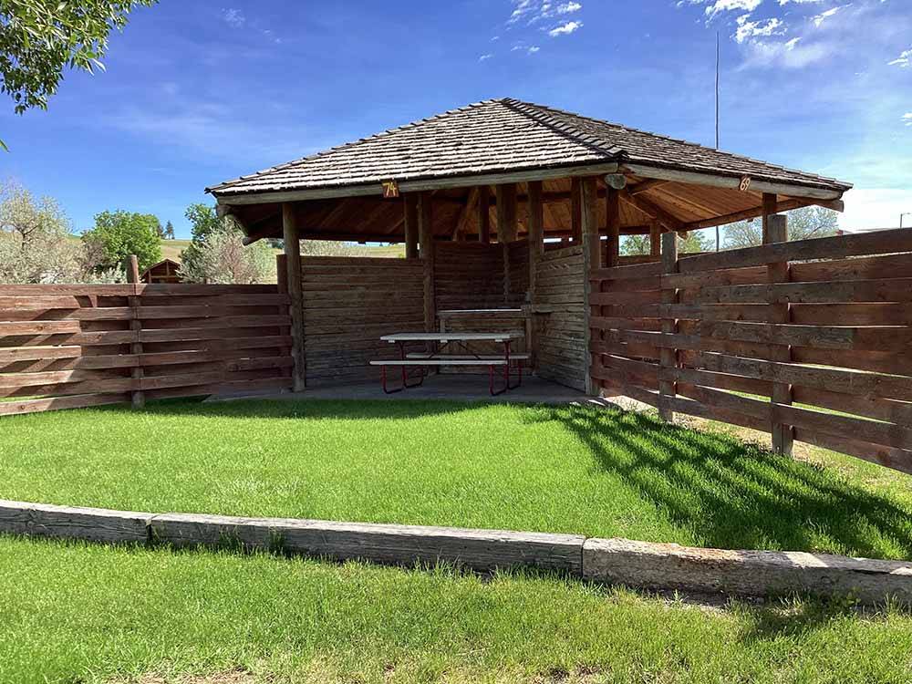 A gazebo with a picnic table at CHOTEAU MOUNTAIN VIEW RV CAMPGROUND