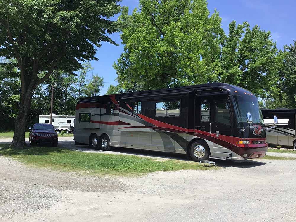 Class A motorhome in a pull thru site at ARCHWAY RV PARK