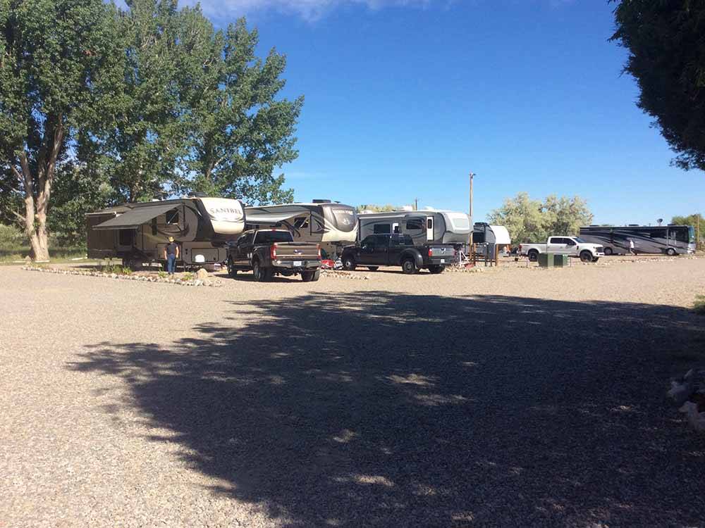 A row of gravel RV sites at WORLAND RV PARK AND CAMPGROUND