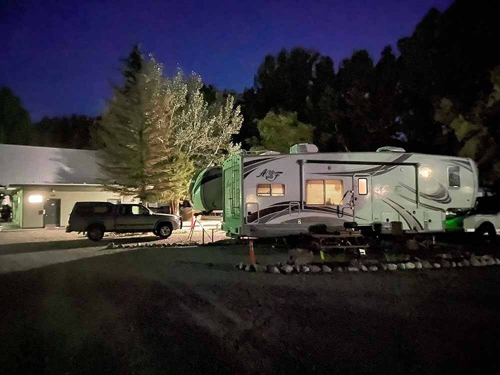 A fifth wheel trailer at night at WORLAND RV PARK AND CAMPGROUND
