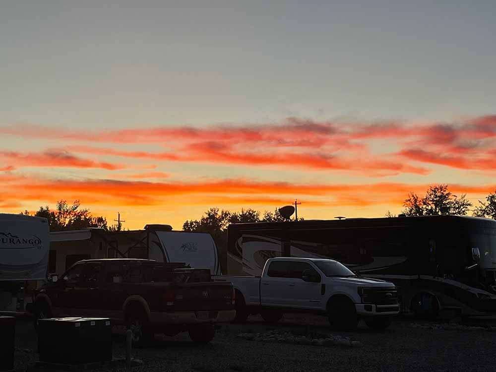 A group of RVs sited at dusk at WORLAND RV PARK AND CAMPGROUND