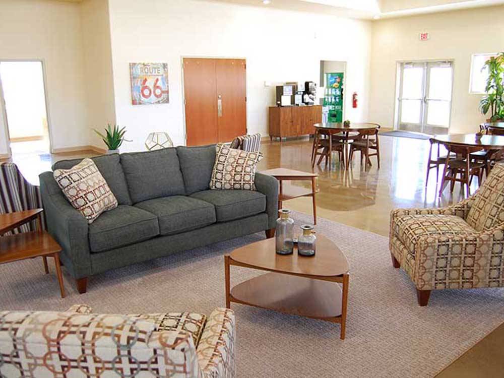 A seating area with couches and chairs at ROUTE 66 RV RESORT