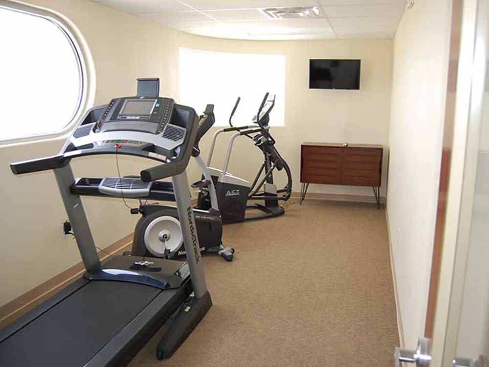 The exercise room with windows at ROUTE 66 RV RESORT