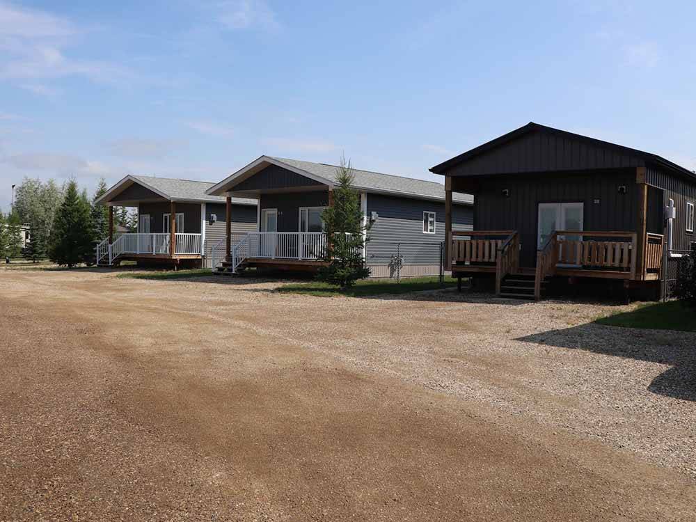 A line of rental cabins at RENDEZ VOUS RV PARK & STORAGE