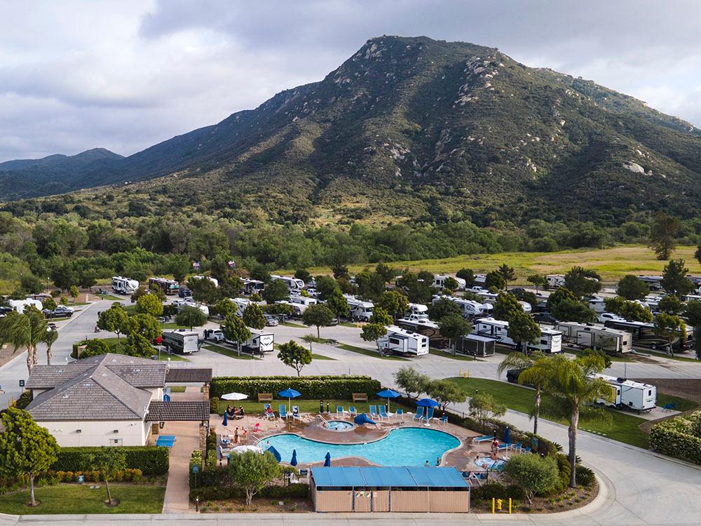 A group of people enjoying lunch and drinks by an motorhome at PALA CASINO RV RESORT