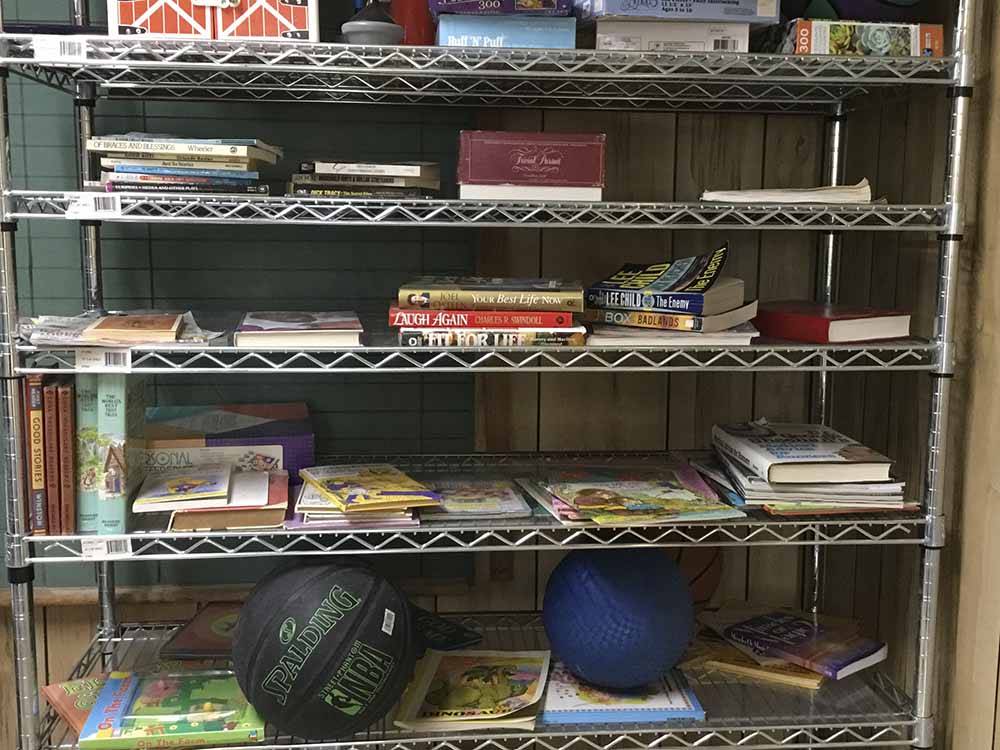 Metal shelves full of books at CONCHO PEARL RV ESTATES
