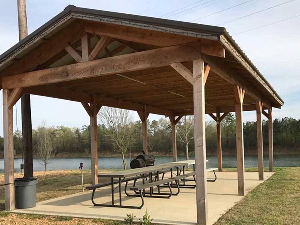 A pavilion by the water at THE COVE LAKESIDE RV RESORT AND CAMPGROUND