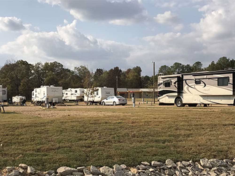 A group of dirt RV sites at THE COVE LAKESIDE RV RESORT AND CAMPGROUND