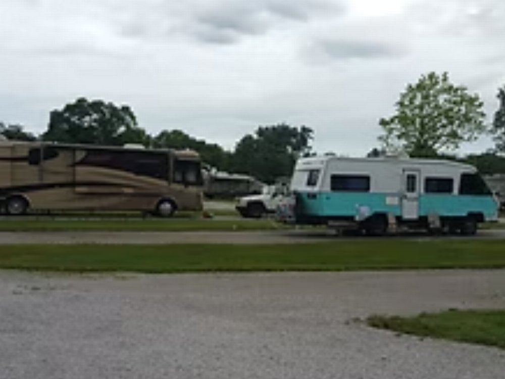 RVs parked in large sites at Camp Mi Casa on the Route RV Park